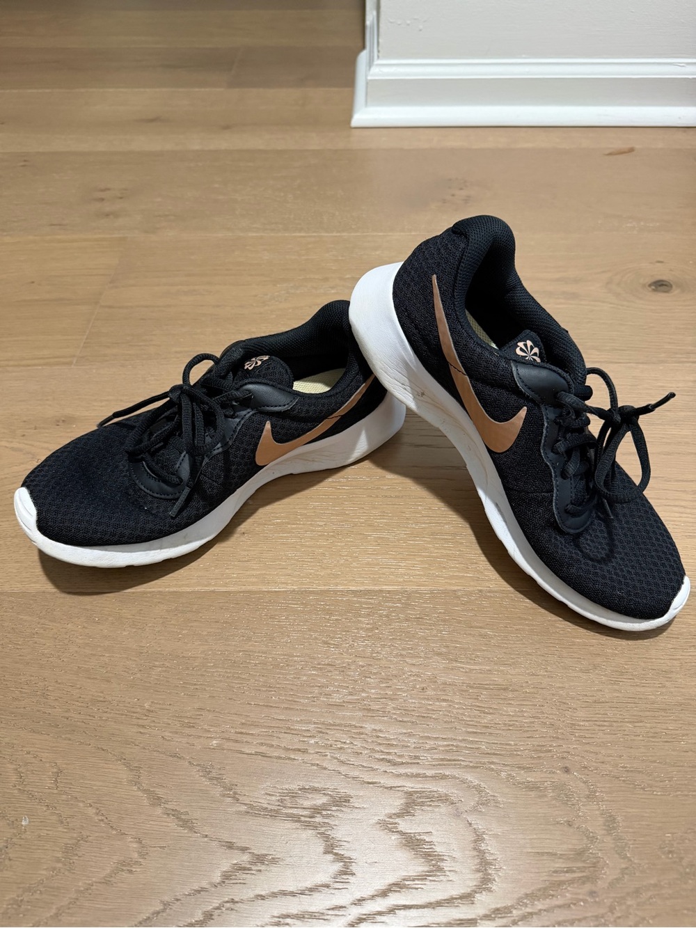 Nike Women’s Black Athletic Shoes with Bronze Swoosh